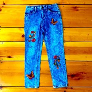 Blue jeans with flowers and butterflies on them 🦋